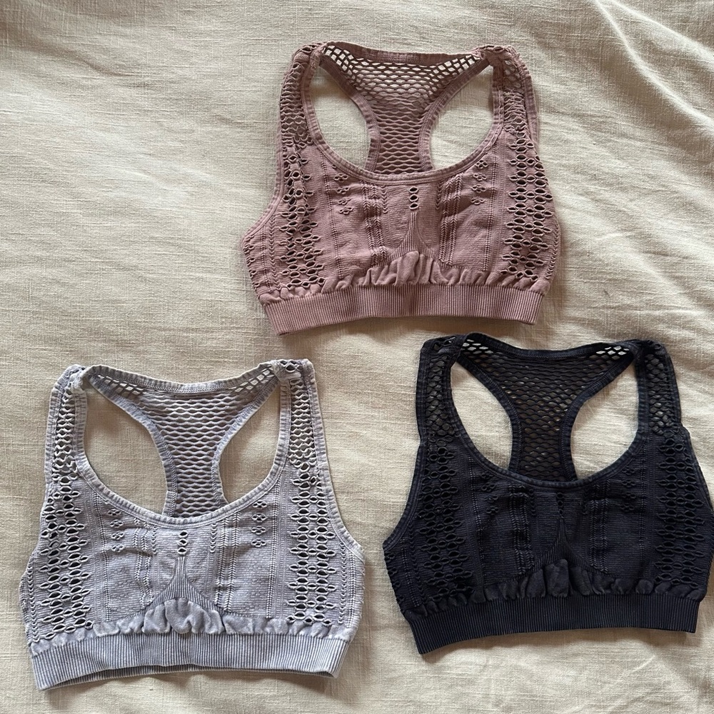 Set of 3 Nikibiki Sports bras. Distressed, Razorback, charcoal, plush and gray.